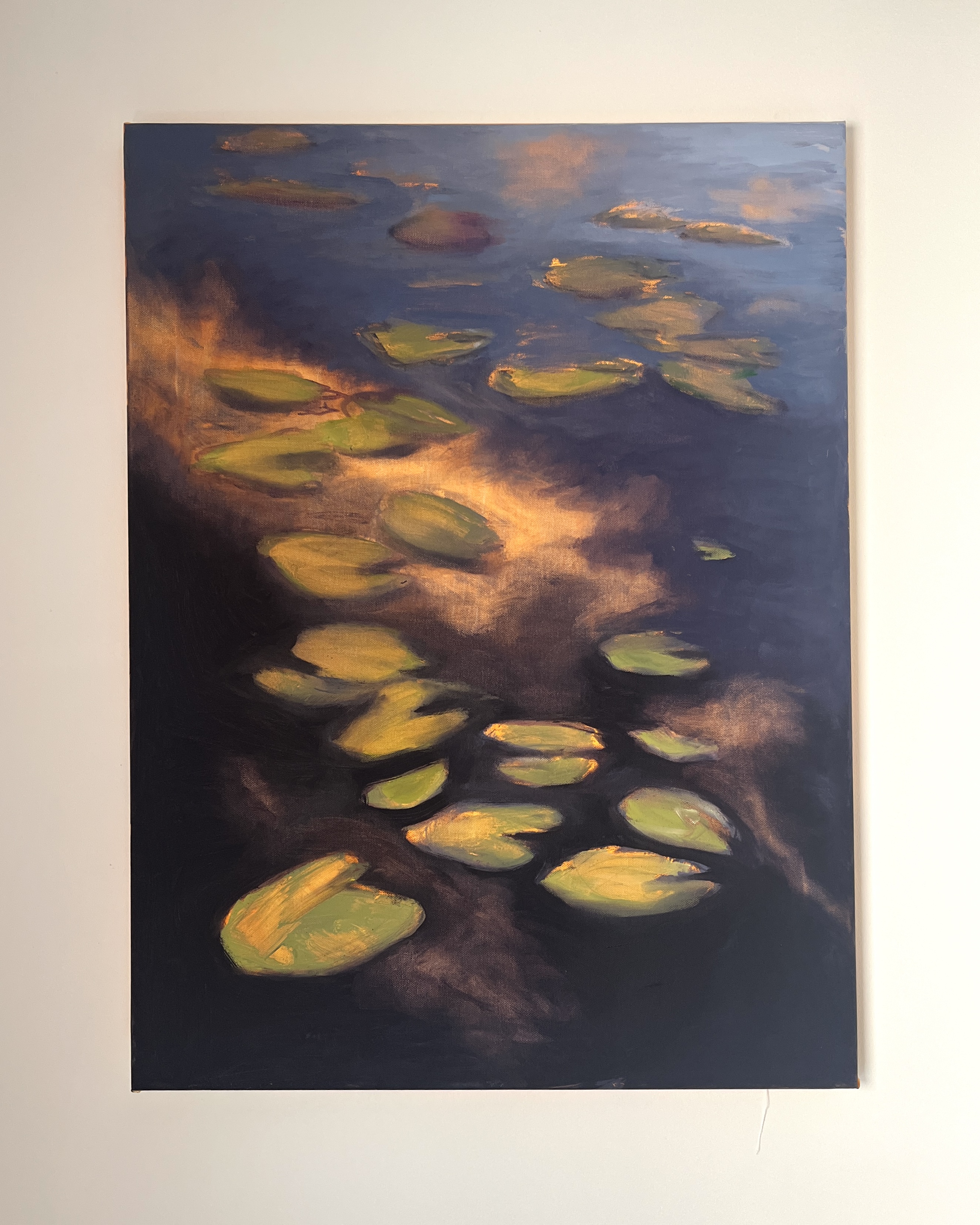 An oil painting of lily pads floating on a dark, reflective body of water. The water shimmers with deep blues and purples, while golden light streaks across the surface, casting an ethereal glow. The lily pads, painted in warm green and ochre tones, seem to drift between stillness and movement, partially dissolving into the water’s shifting reflections. The scene carries a sense of quiet tension, as if capturing a fleeting moment before it vanishes into darkness.oil painting, lily pads, water reflections, golden light, deep blues, purples, ochre, green, movement, stillness, ethereal, dreamlike, moody, atmospheric, abstract realism.